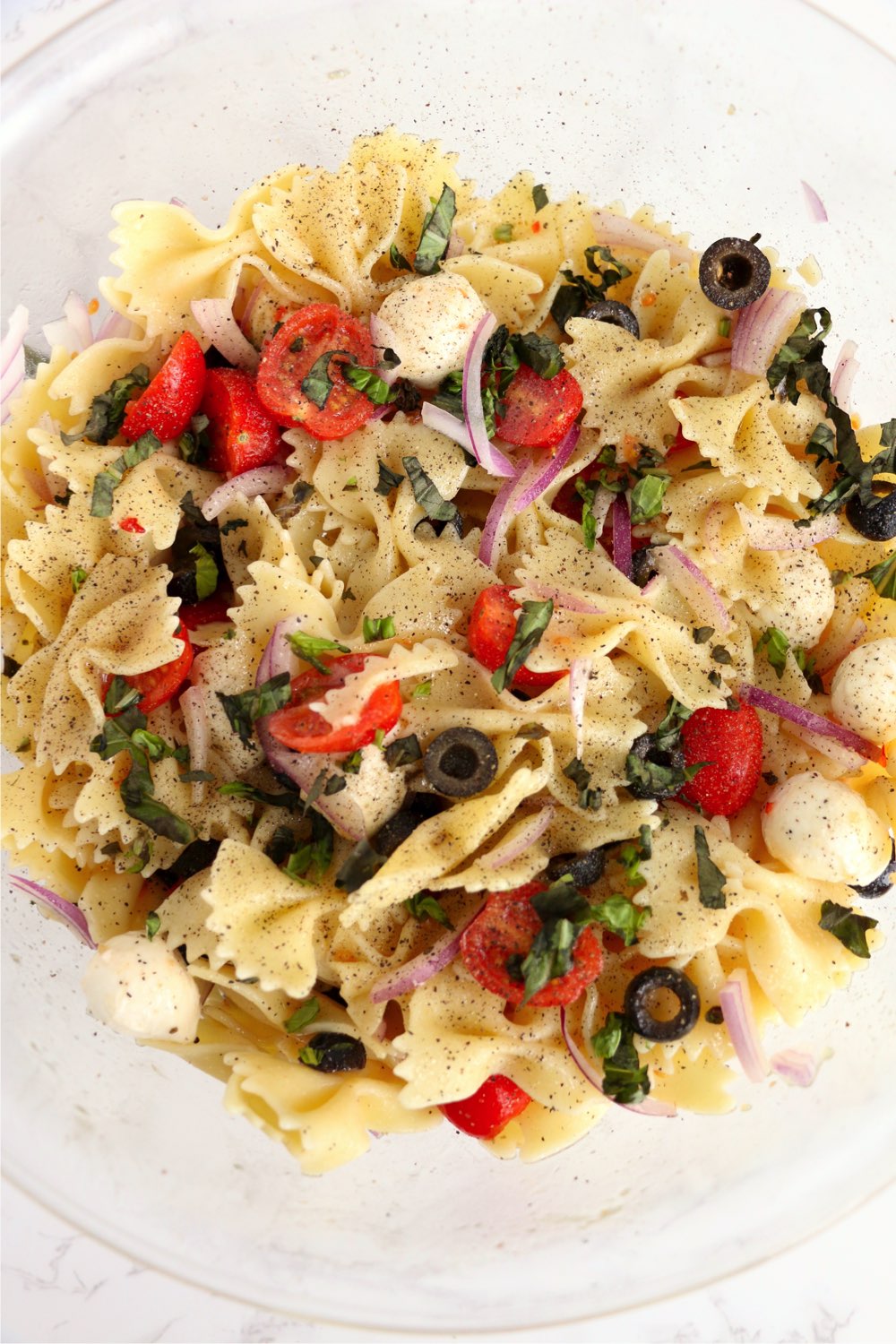 Caprese bowtie pasta salad in bowl