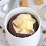 caramel and vanilla ice cream on top of chocolate mug cake