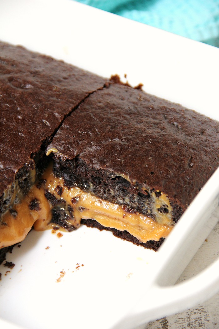 Easy Caramel Fudge Cake - An easy chocolate fudge cake filled with gooey melted caramel. No frosting required! Serve warm with a scoop of vanilla ice cream! Sooo good!