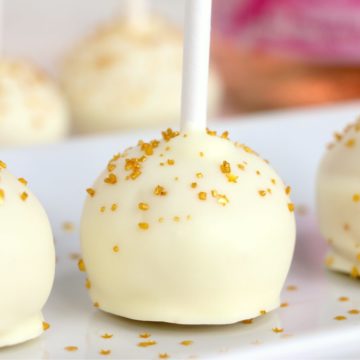 row of cake pops on a white platter
