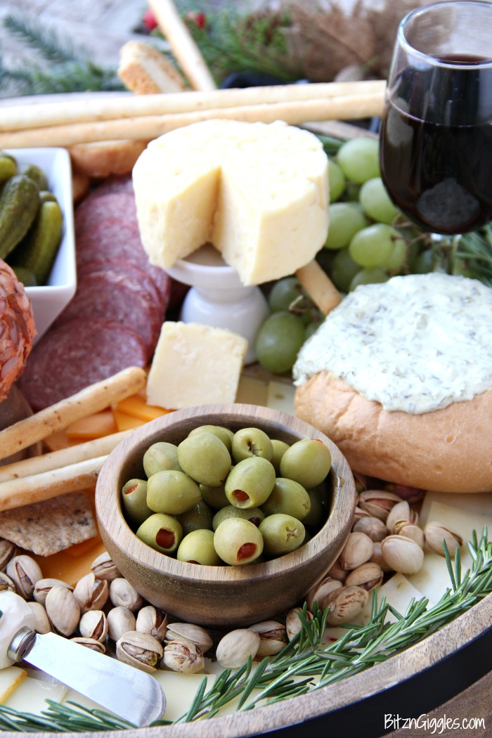 How to Assemble a Charcuterie Board - Step-by-step instructions on how to make your own charcuterie board! This is such an easy and stunning idea for a party!