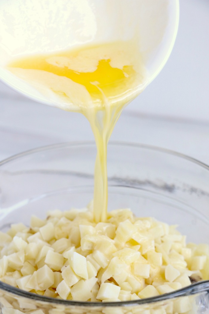 Cheesy Hashbrown Potatoes - Cheesy potato casserole topped with crunchy French fried onions! One of the best hash brown casserole recipes out there!