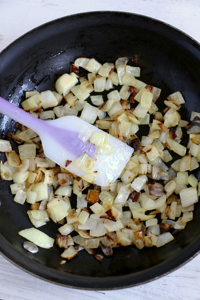 Cheesy Hashbrown Potatoes - Cheesy potato casserole topped with crunchy French fried onions! One of the best hash brown casserole recipes out there!