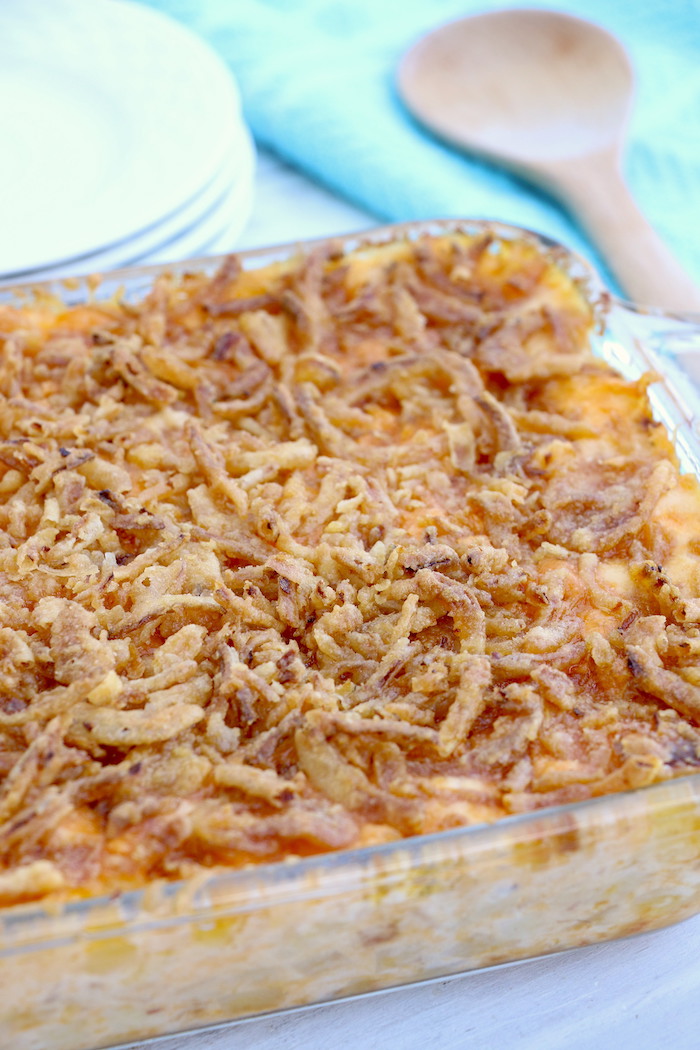 Cheesy Hashbrown Potatoes - Cheesy potato casserole topped with crunchy French fried onions! One of the best hash brown casserole recipes out there!