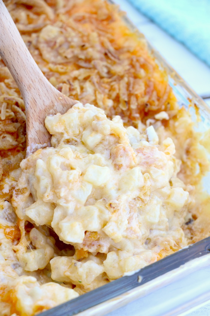 Cheesy Hashbrown Potatoes - Cheesy potato casserole topped with crunchy French fried onions! One of the best hash brown casserole recipes out there!