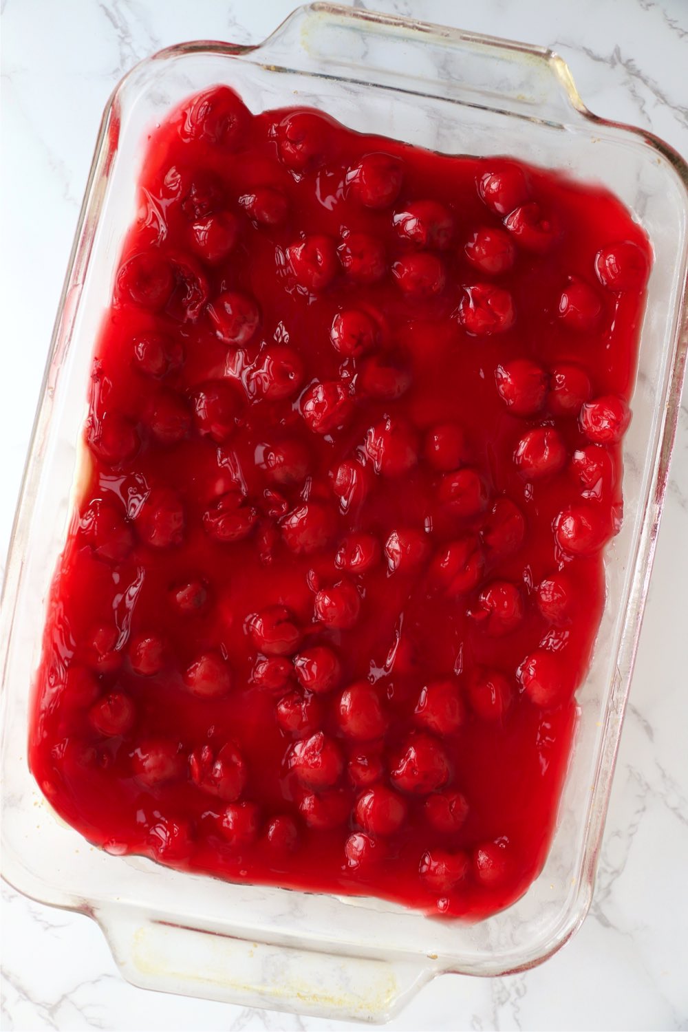 Cherry pie filling in glass baking pan
