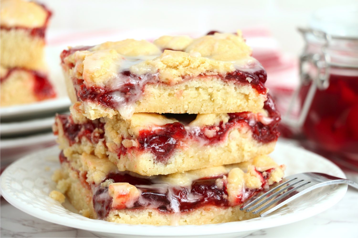 stack of iced kuchen bars on a white plate