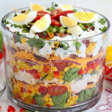 trifle bowl filled with a layer salad