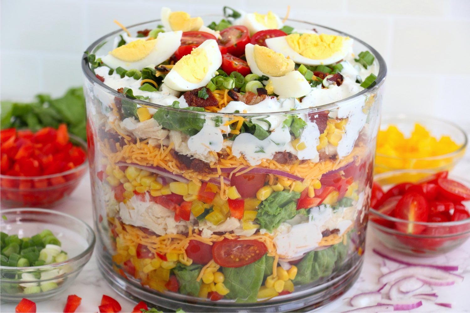 trifle bowl filled with a layer salad