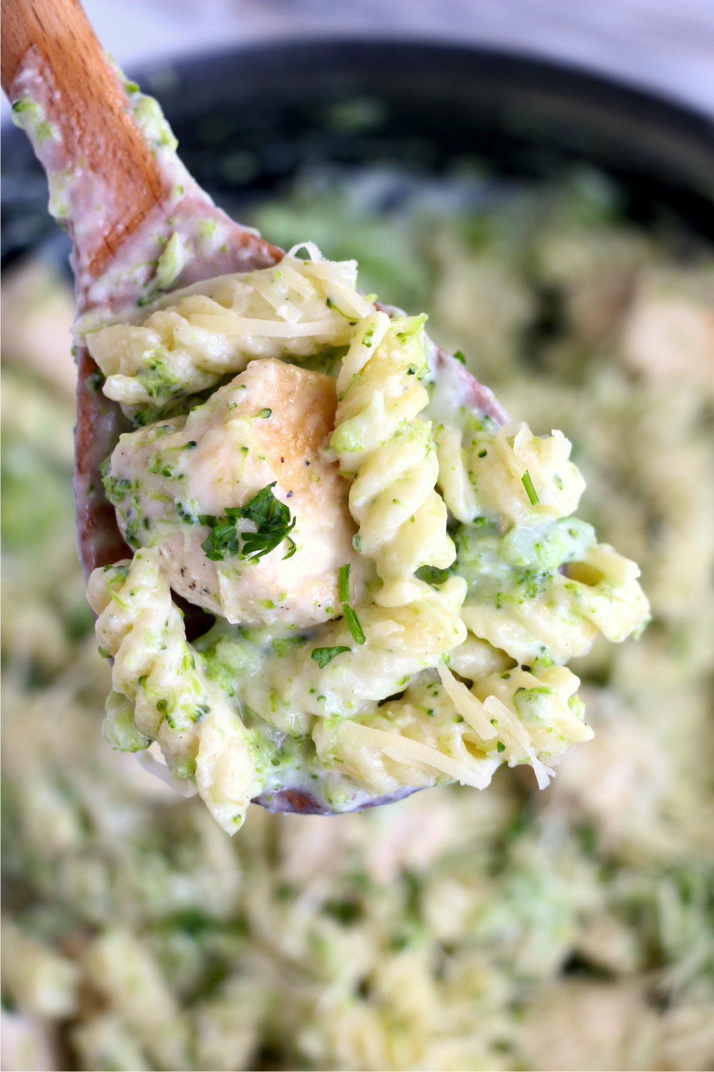 A spoonful of chicken broccoli alfredo