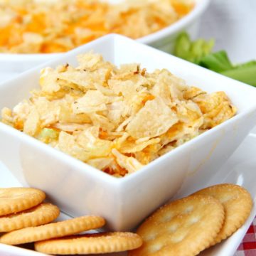 Chicken Salad Dip - This easy dip is a twist on a classic hot chicken salad recipe that I've had in my recipe box for some time now. It's a cheesy and creamy chicken mixture topped with crushed potato chips and perfect for cracker or tortilla chip dipping!