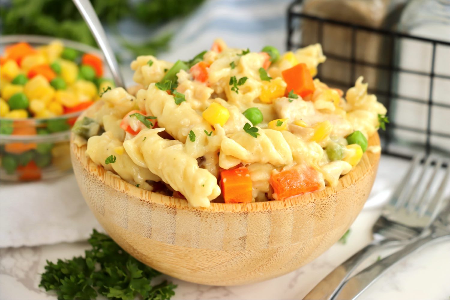 wooden bowl filled with pasta and vegetables