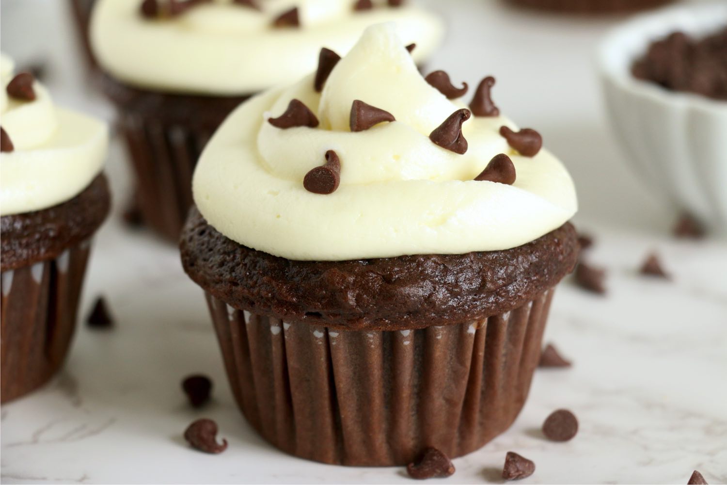 close up of chocolate frosted cupcakes