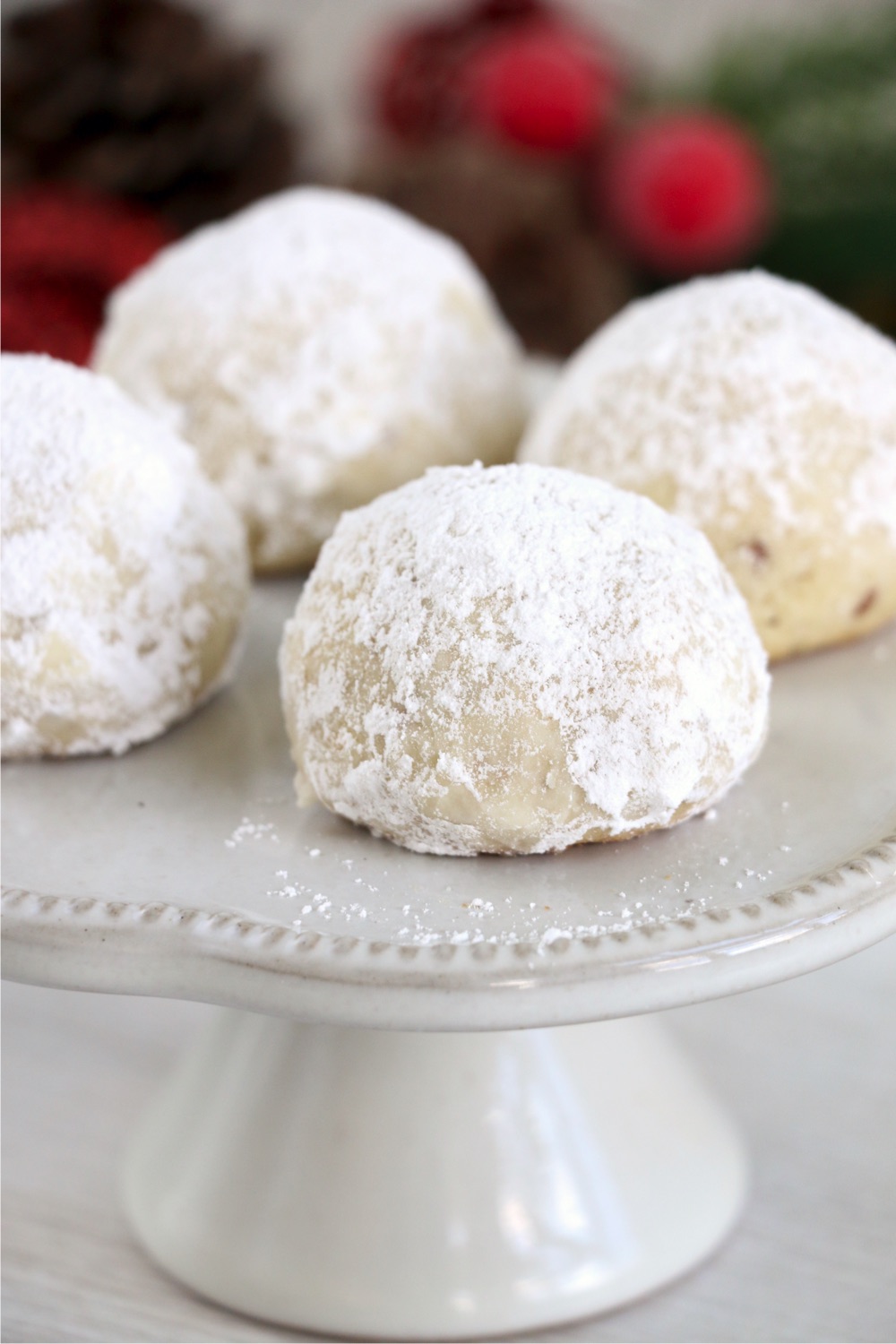 cake stand holding snowball cookies