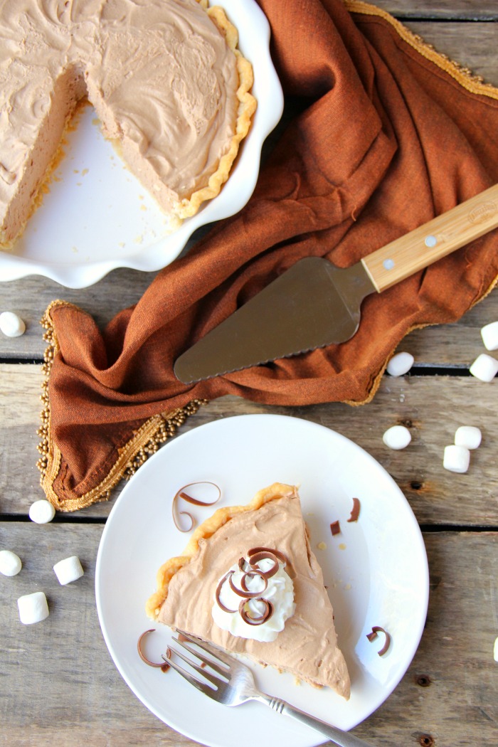 Mile High Chocolate Mousse Pie - Creamy, decadent chocolate mousse piled high and finished off with whipped cream and chocolate shavings.