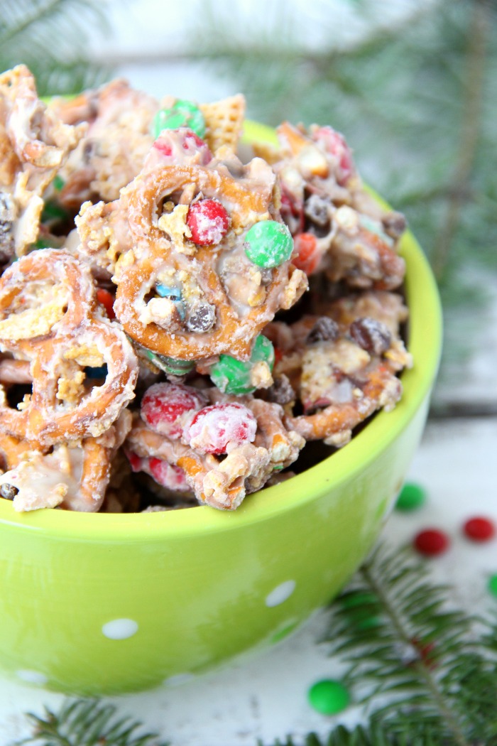 Christmas Crunch Snack Mix - An addicting combination of sweet and salty deliciousness enveloped in decadent white chocolate!