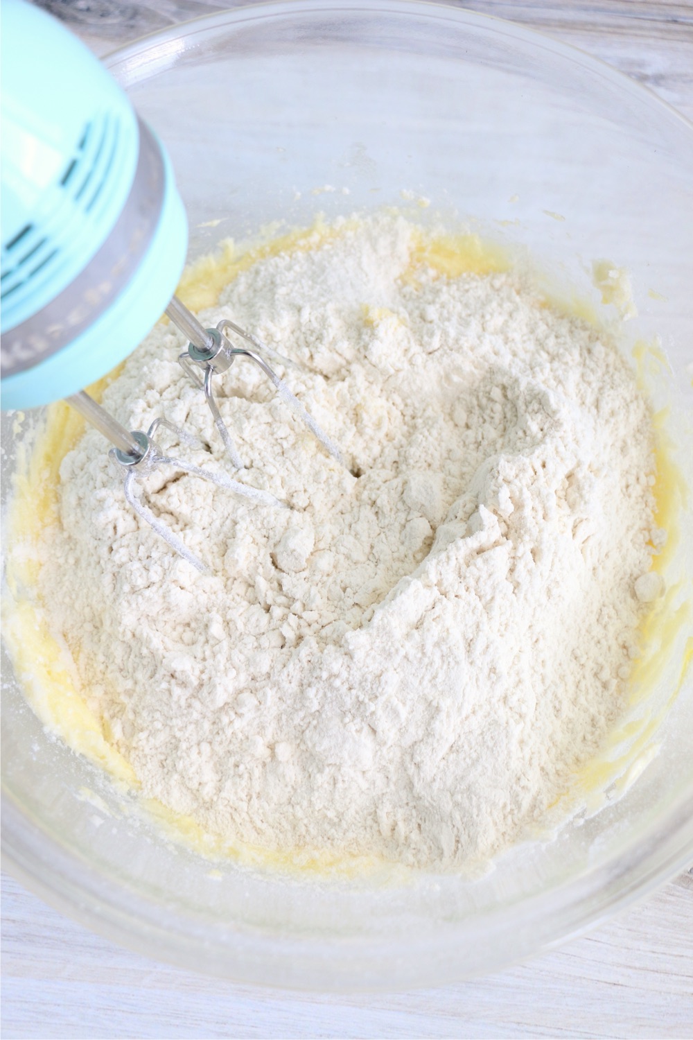 Adding dry ingredients to wet ingredients for cake bars