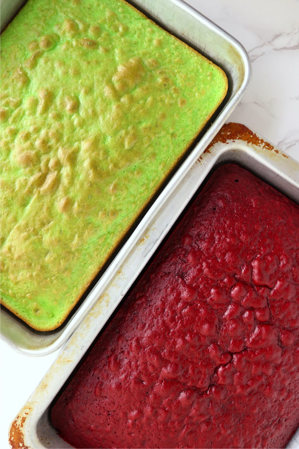 Pans of green and red velvet cakes.