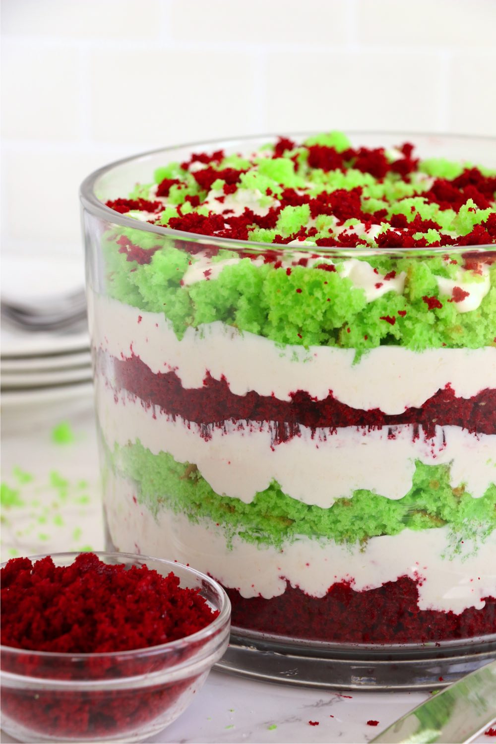 Trifle dessert with green and red layers of cake.