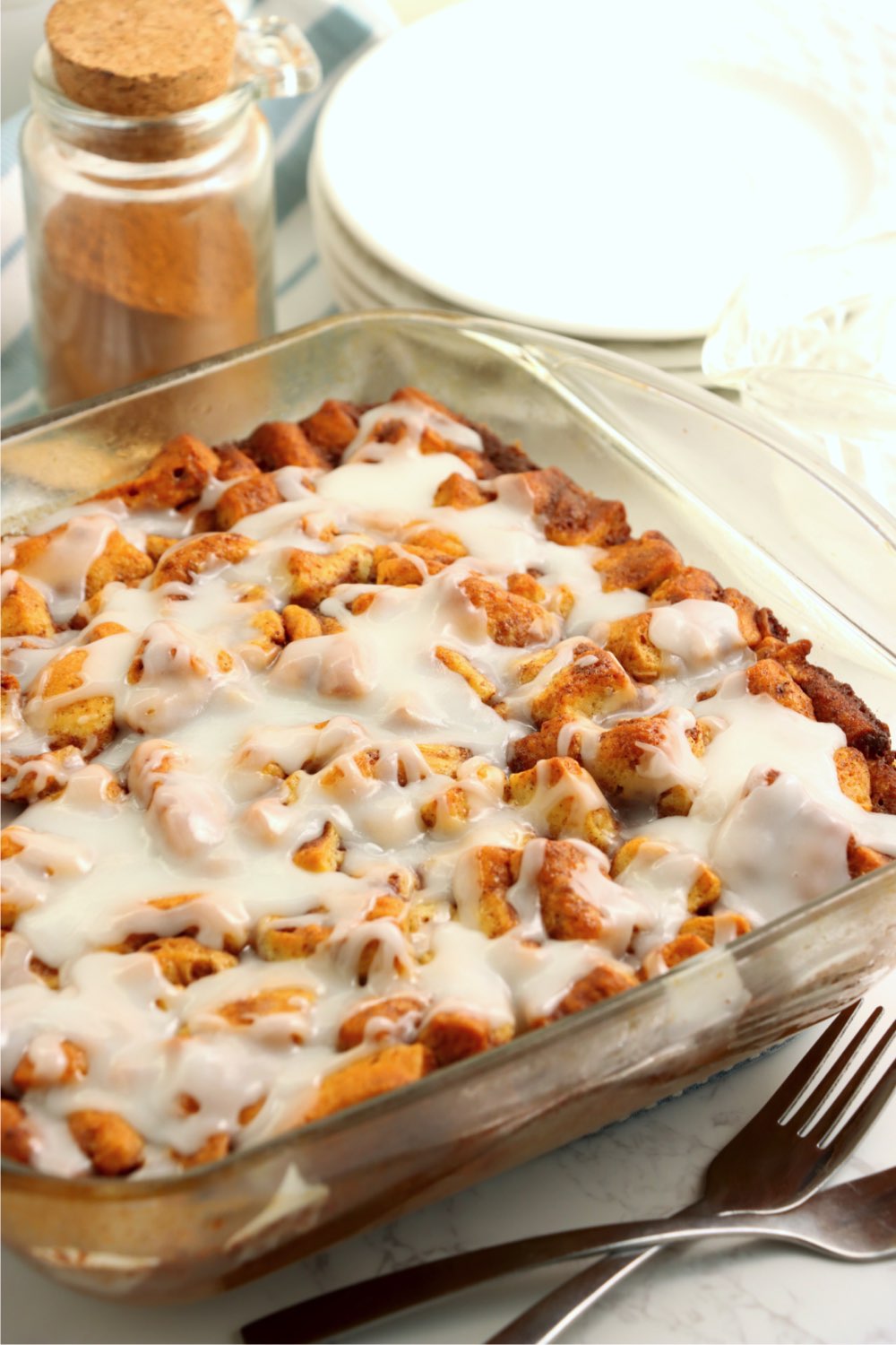 glass oven dish filled with cinnamon rolls
