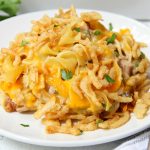 Classic Tuna Noodle Casserole - Ready in under 45 minutes, this classic and comforting casserole features tuna, onions, mushrooms, peas and cheese in a creamy sauce topped with more cheese and crunchy French fried onions! So flavorful, and sure to satisfy the entire family!