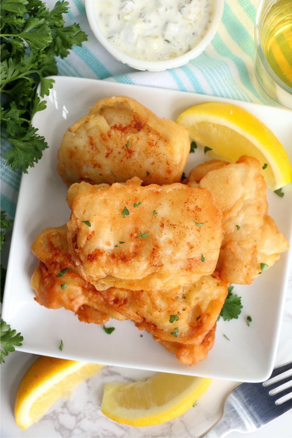 deep fried fish stacked on plate
