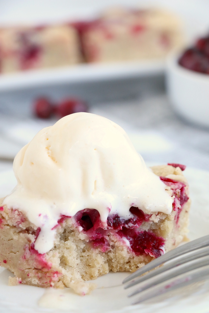 Easy Cranberry Cake - An easy and delicious cake bursting with tart cranberries. Top with vanilla ice cream and enjoy!
