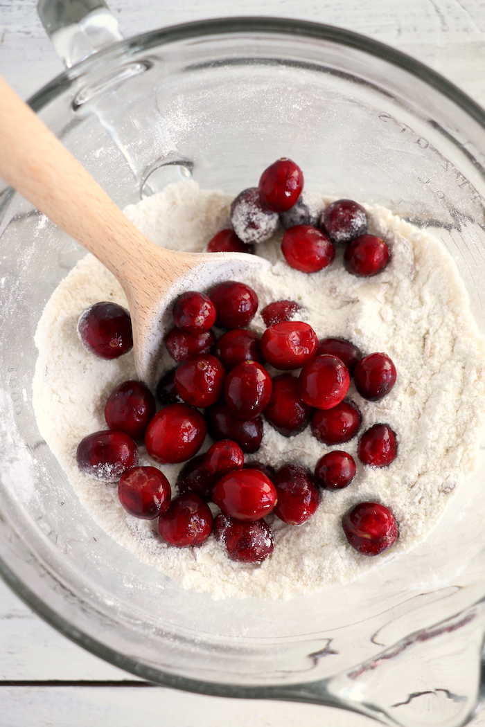 Easy Cranberry Cake - An easy and delicious cake bursting with tart cranberries. Top with vanilla ice cream and enjoy!
