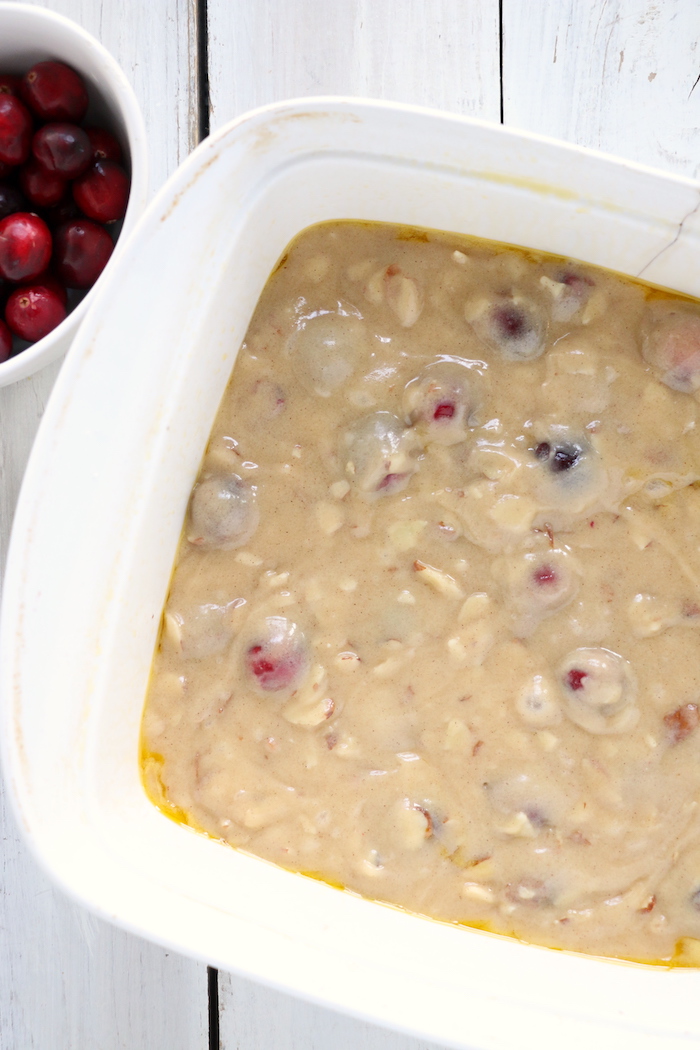 Easy Cranberry Cake - An easy and delicious cake bursting with tart cranberries. Top with vanilla ice cream and enjoy!