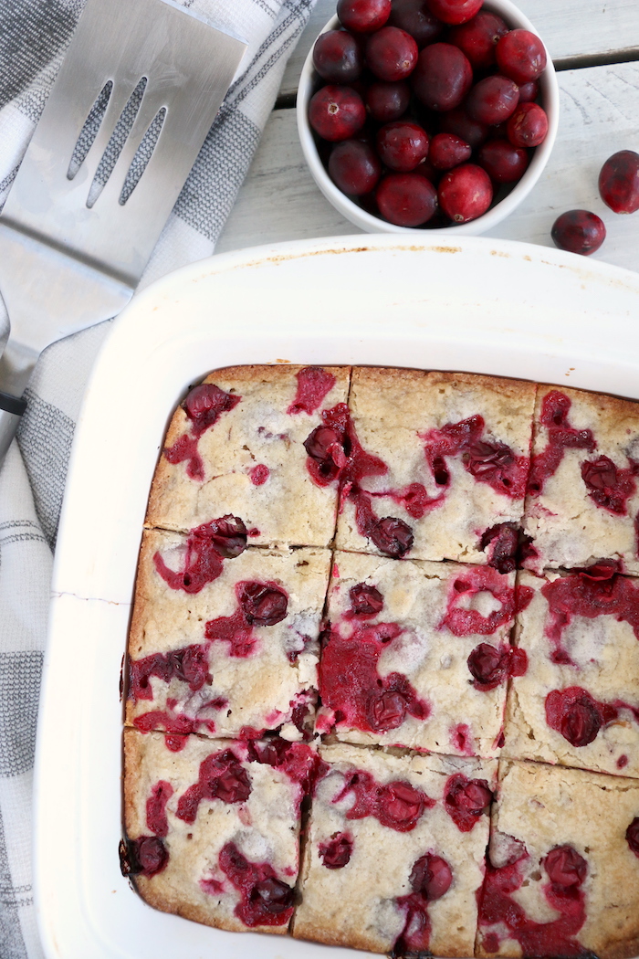 Easy Cranberry Cake - An easy and delicious cake bursting with tart cranberries. Top with vanilla ice cream and enjoy!