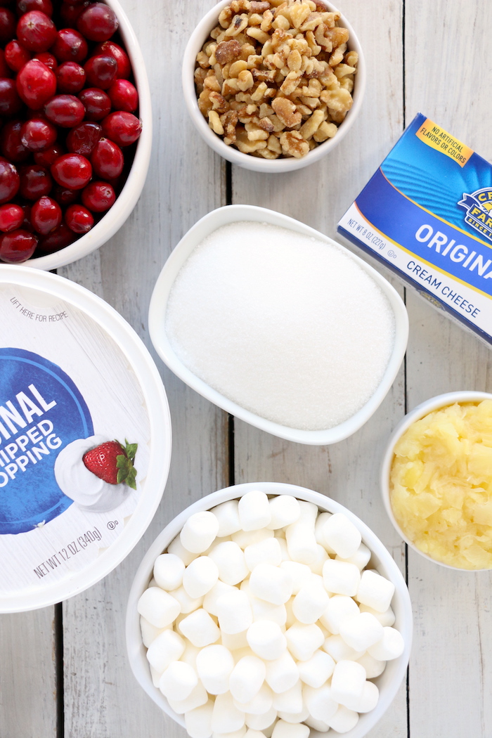 Cranberry Fluff - Tangy, chilled cranberries and sweet crushed pineapple, folded into marshmallow-filled whipped cream makes this side dish a family favorite!