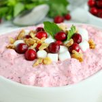 Cranberry Fluff - Tangy, chilled cranberries and sweet crushed pineapple, folded into marshmallow-filled whipped cream makes this side dish a family favorite!