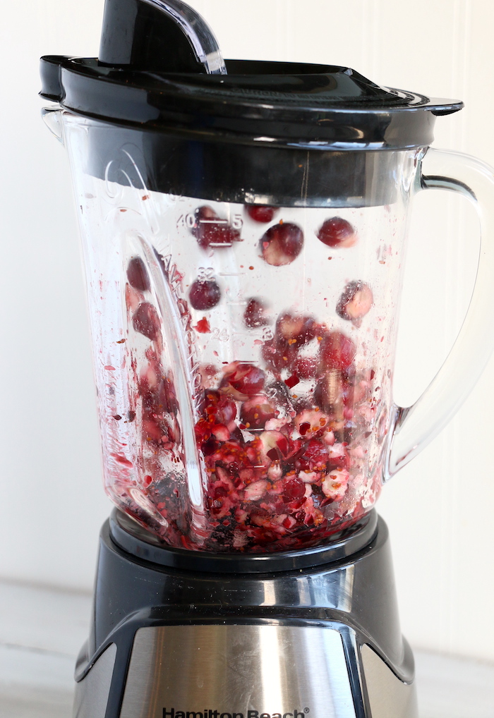 Cranberry Fluff - Tangy, chilled cranberries and sweet crushed pineapple, folded into marshmallow-filled whipped cream makes this side dish a family favorite!
