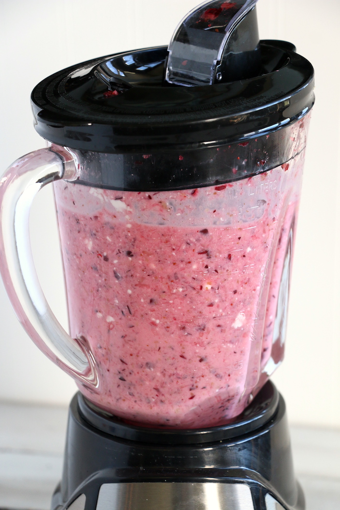 Cranberry Fluff - Tangy, chilled cranberries and sweet crushed pineapple, folded into marshmallow-filled whipped cream makes this side dish a family favorite!