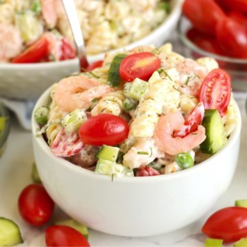small white bowl filled with shrimp and noodles
