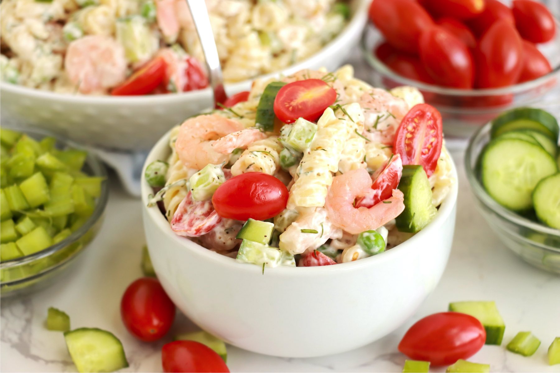 small white bowl filled with shrimp and noodles