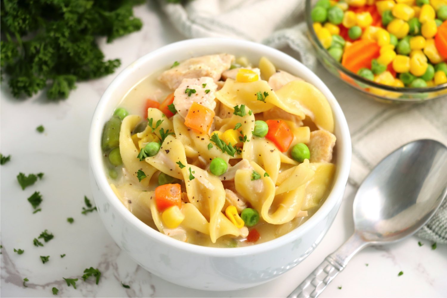 bowl of soup with veggies and noodles