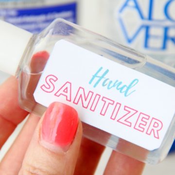 hand holding a bottle of homemade hand sanitizer