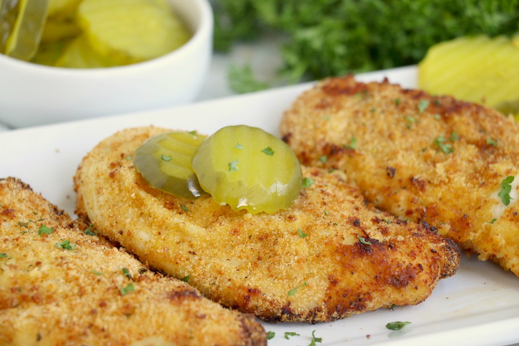Chicken breasts with pickle slices on top