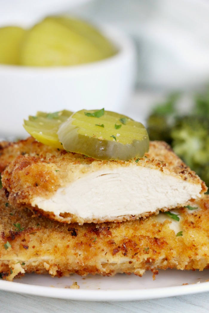 Sliced chicken breast with pickle slices on top