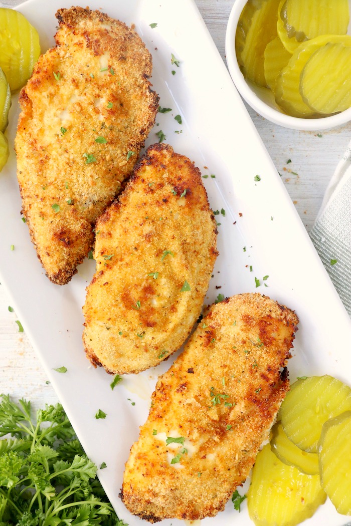Crispy, breaded chicken breasts on platter