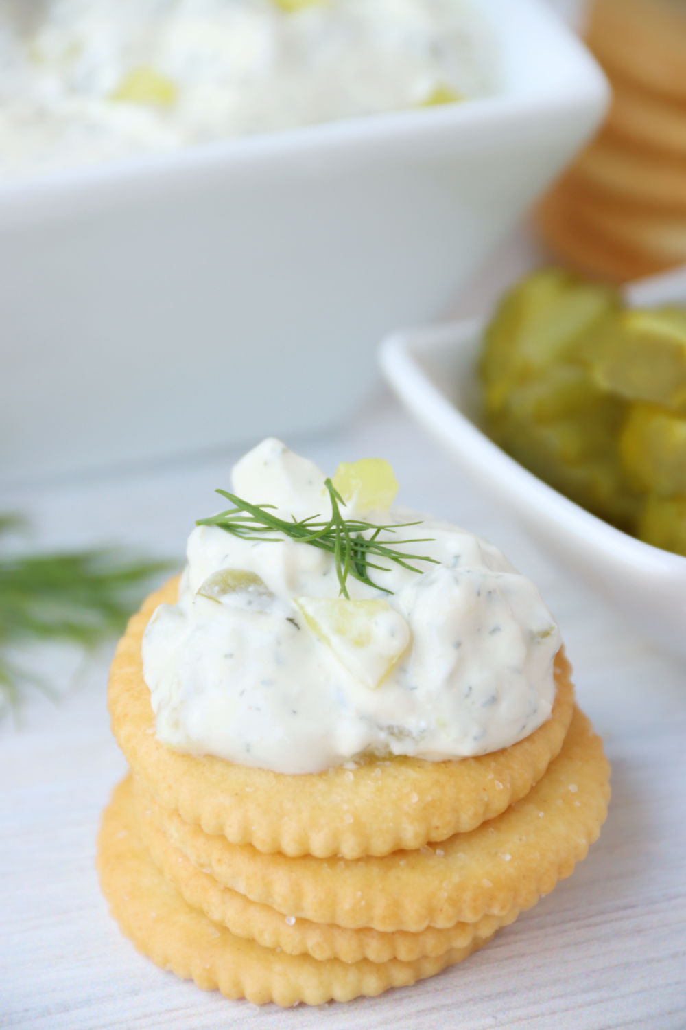 dill pickle dip on a stack of crackers