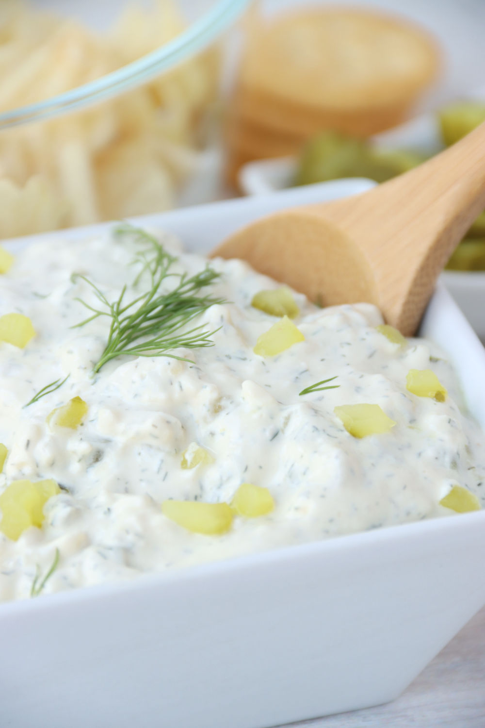 wooden spoon in bowl of dill pickle dip
