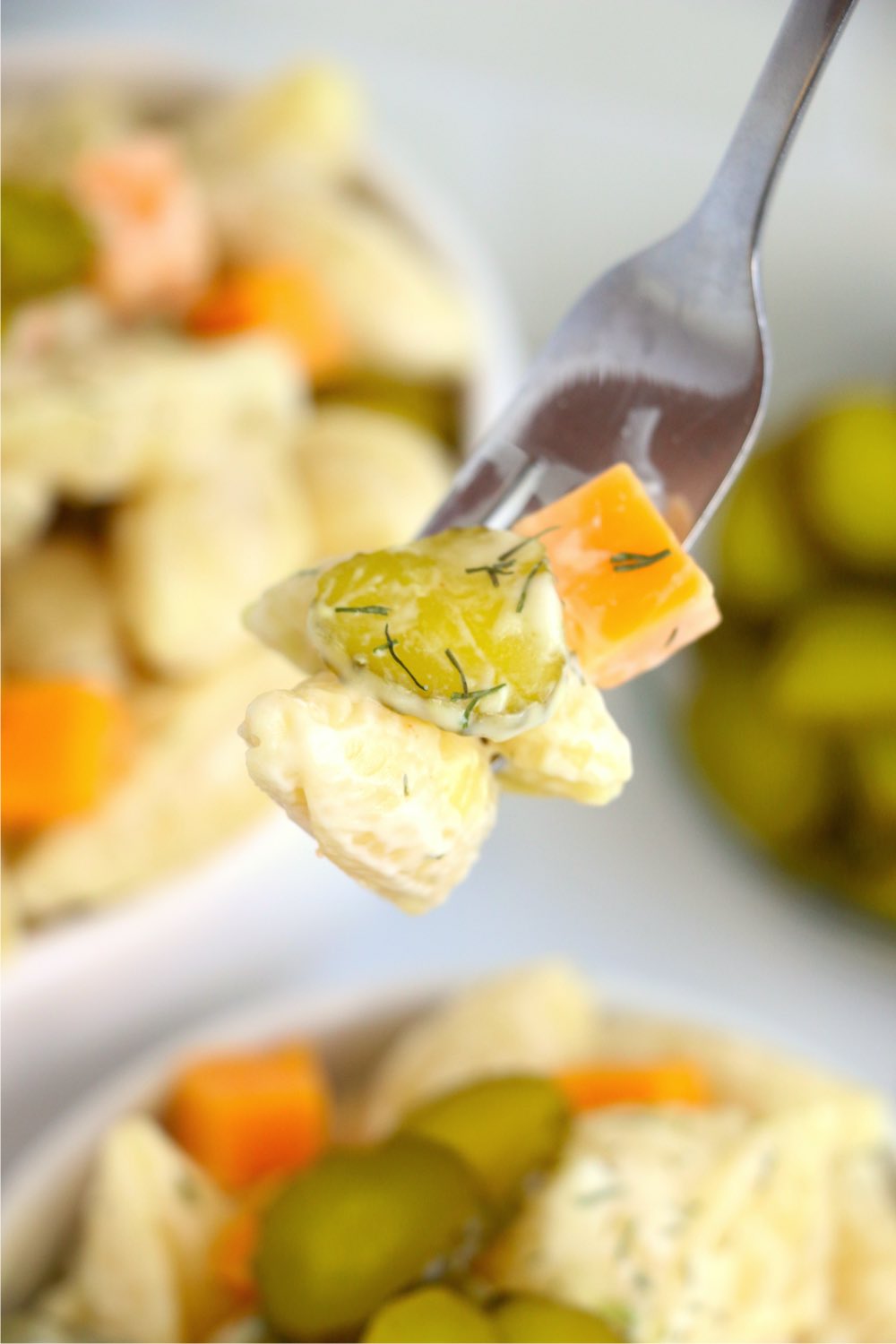 fork holding pasta salad