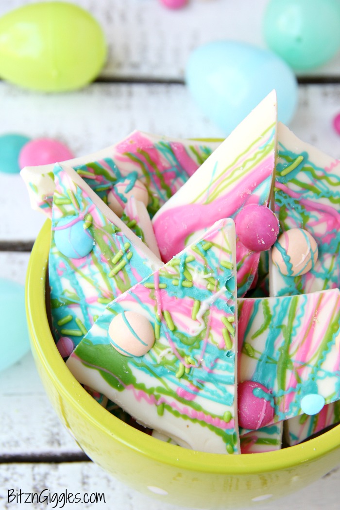 Drizzled Candy Bark - A fun twist on traditional candy bark with M&Ms, sprinkles and colored candy coating drizzle! Perfect for spring and Easter!