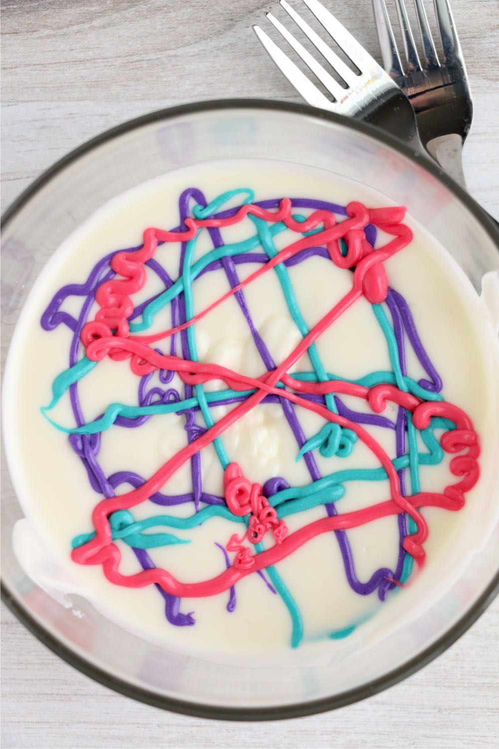 Colored drizzle added to melted vanilla bark