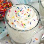 mug cake with bowl of sprinkles in the background