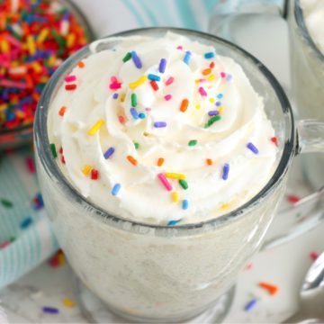 mug cake with bowl of sprinkles in the background
