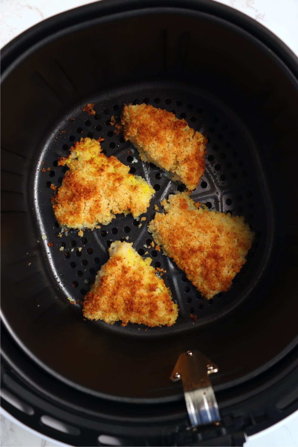 cod filets in an air fryer basket