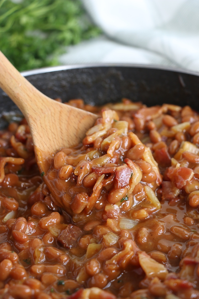 Wooden spoonful of baked beans
